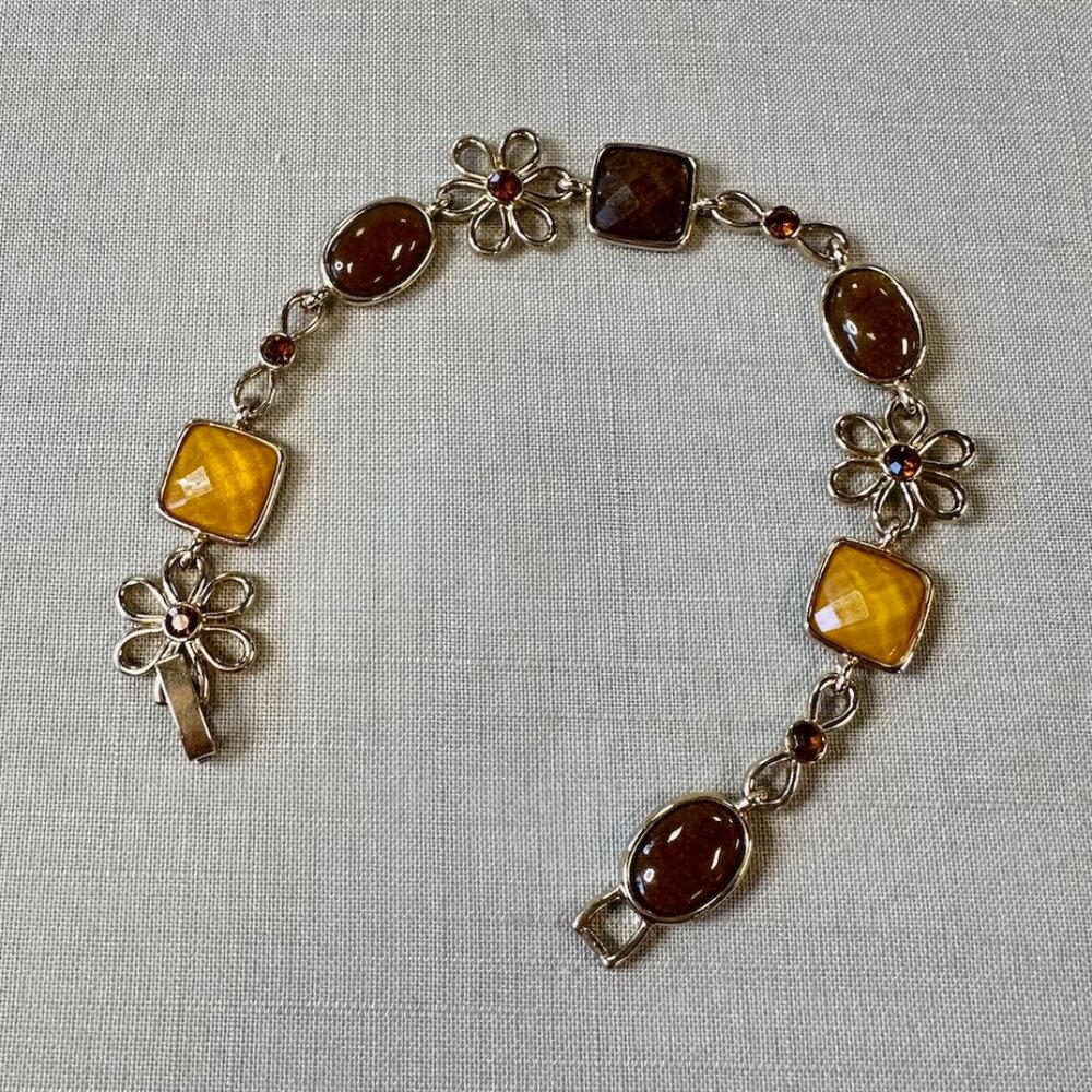 Vintage Gold Tone Bracelet with Flower Designs and Faux Amber Gems